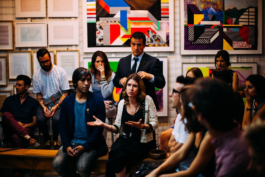 A small group of members deep in discussion at a meetup